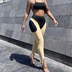 2 piece solid back out halter top with two tone split him leggings.